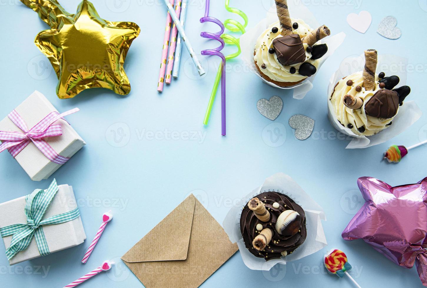 A top down view of common birthday party items in a border frame. photo