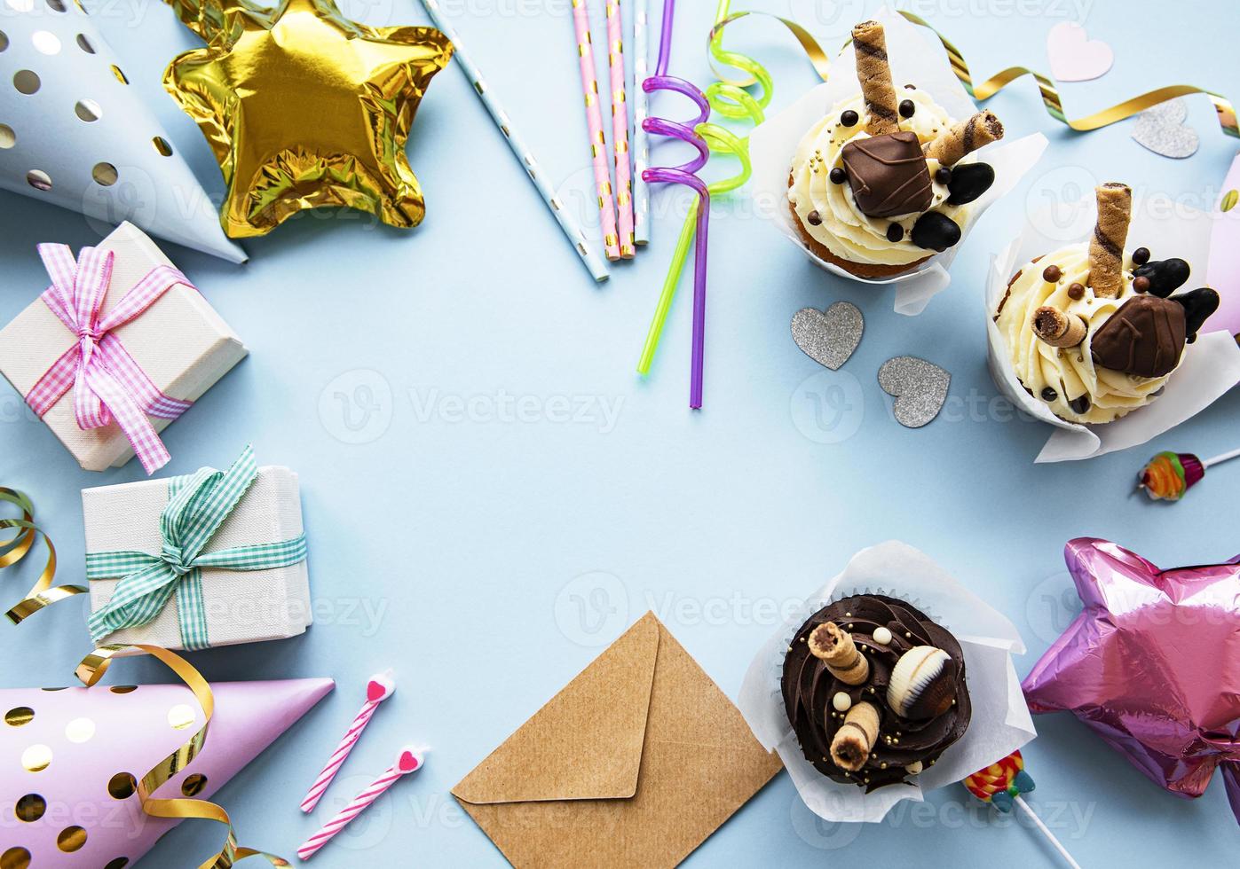 A top down view of common birthday party items in a border frame. photo