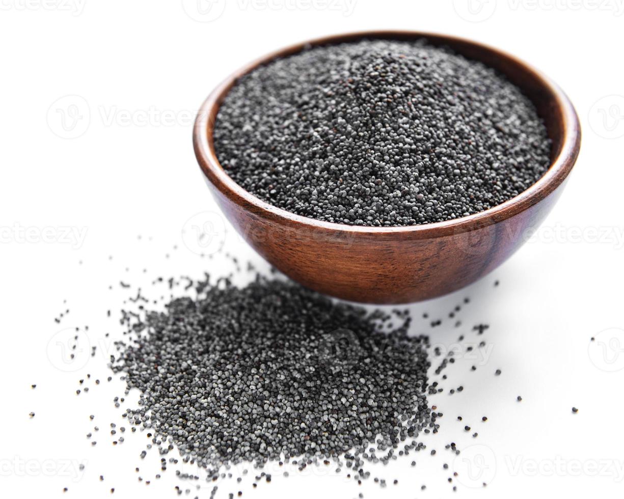 Poppy seeds in small wooden bowl photo