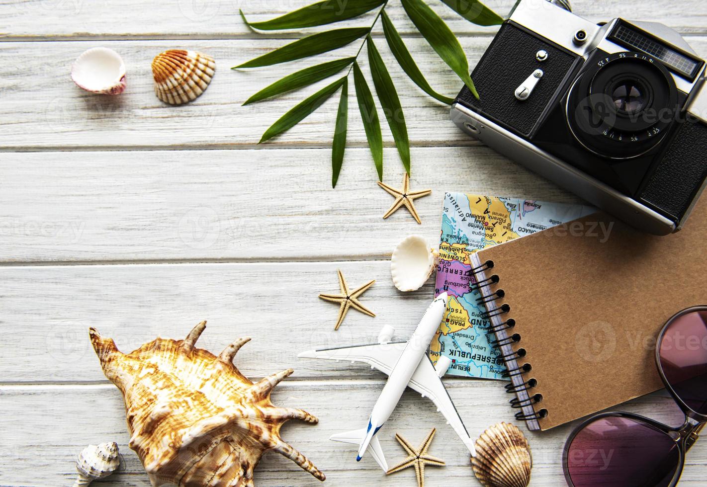 Traveler accessories on wooden  background photo