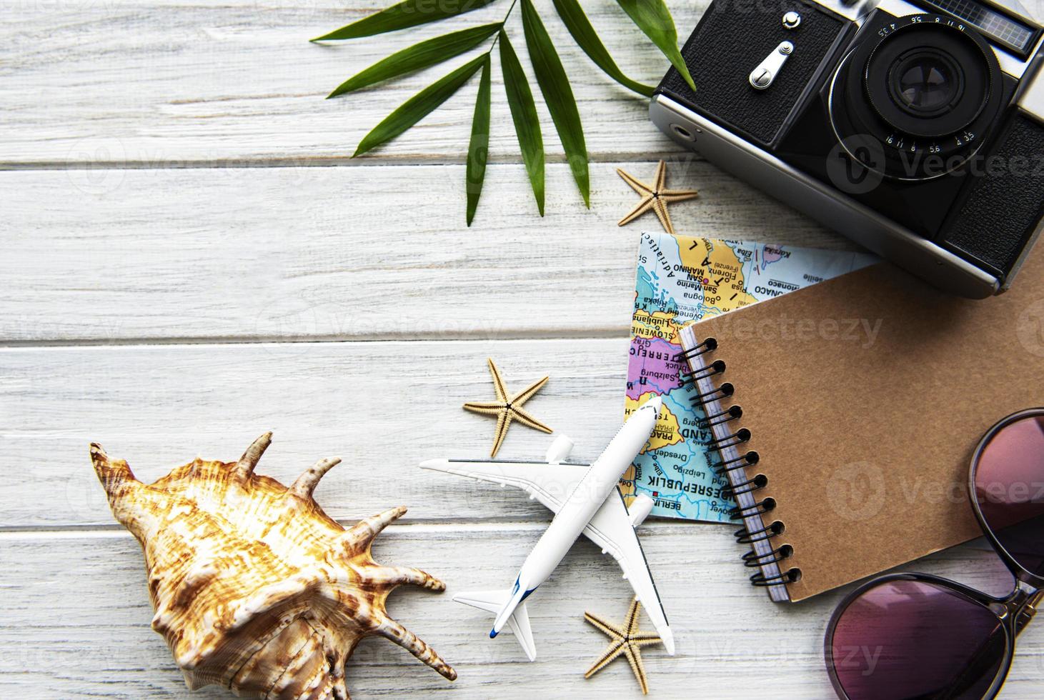 Traveler accessories on wooden  background photo