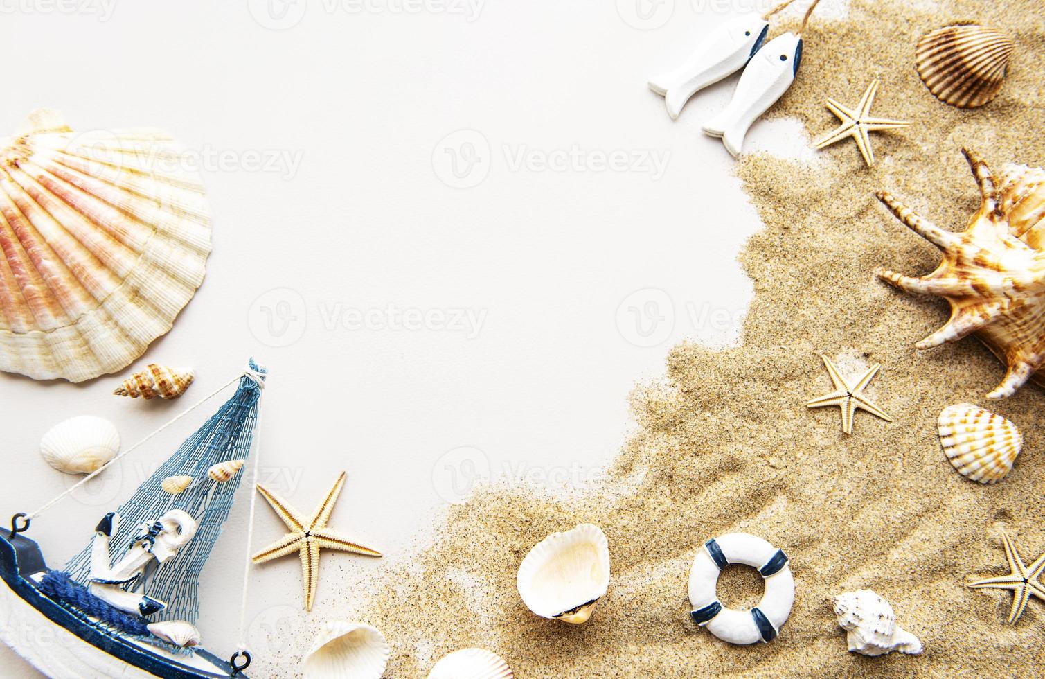 Seashells on sand. Travel concept. photo