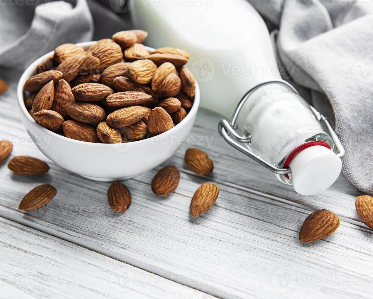 Almond milk with almonds photo