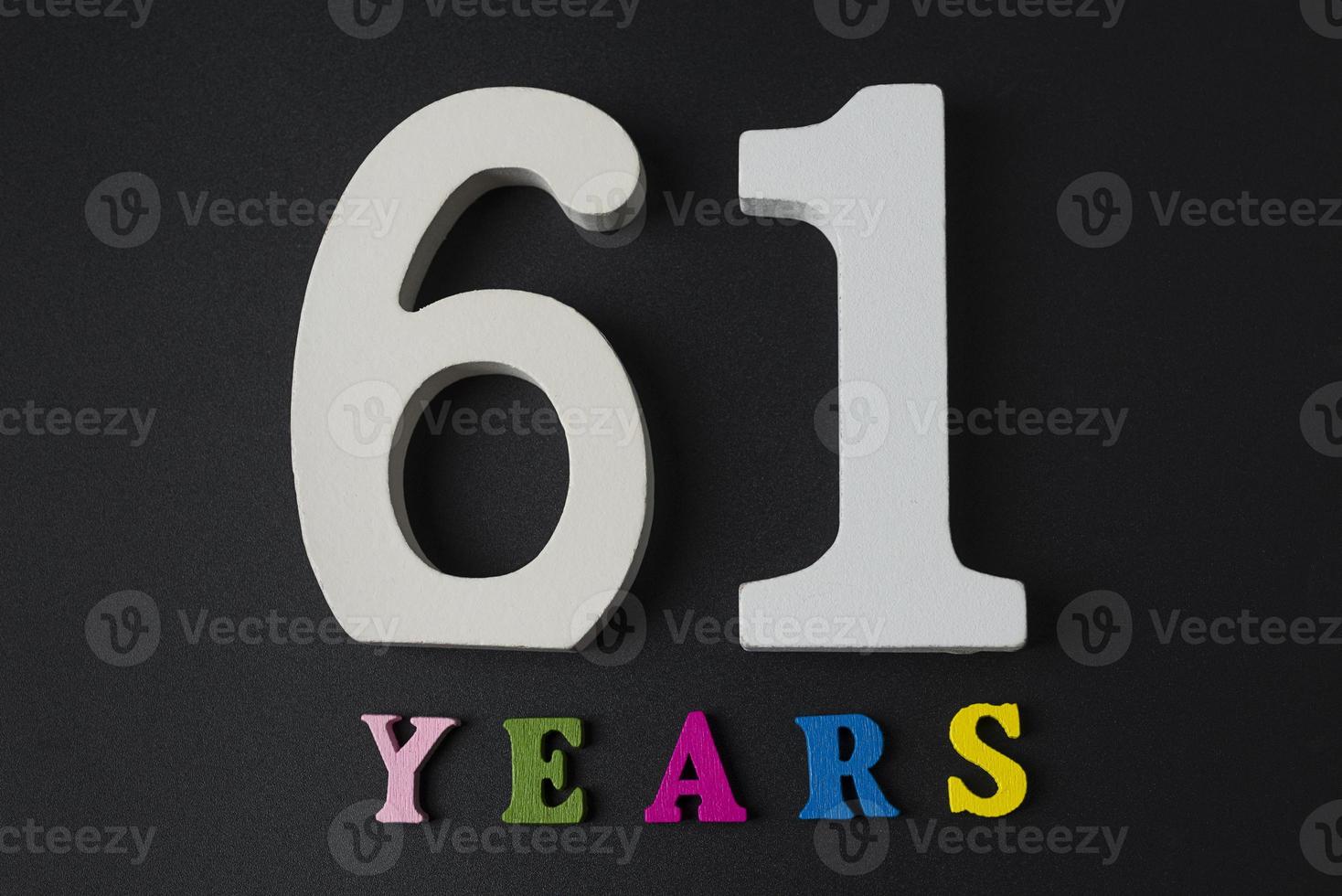 Letters and numbers-sixty-one on a black background. photo