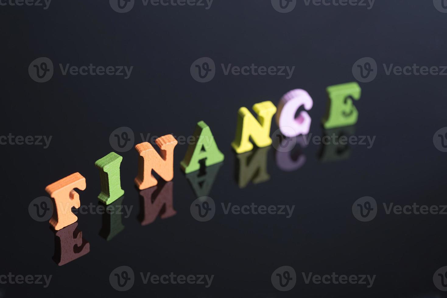 The word Finance on a black background. photo