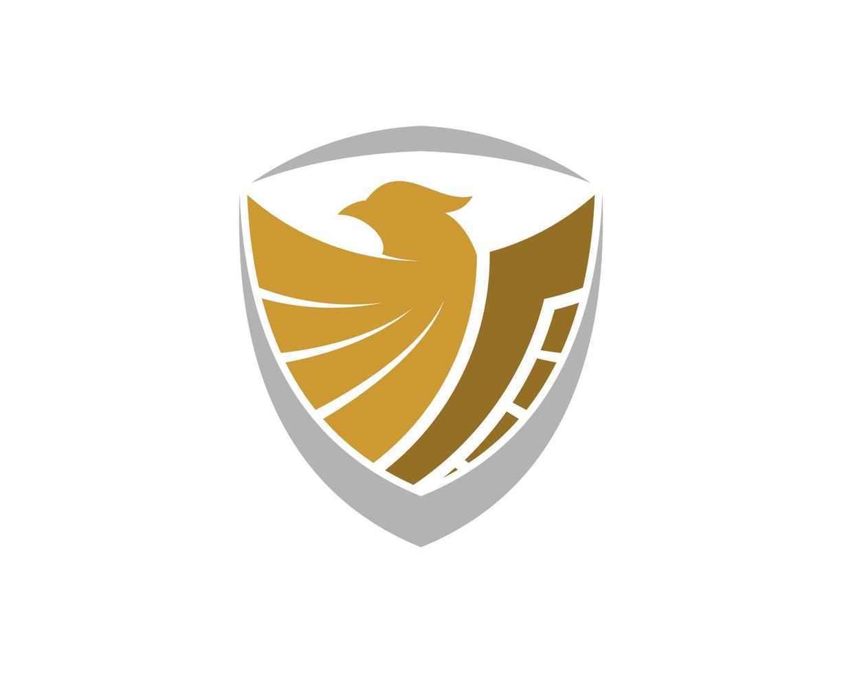 Abstract shield with gold spread wing eagle vector