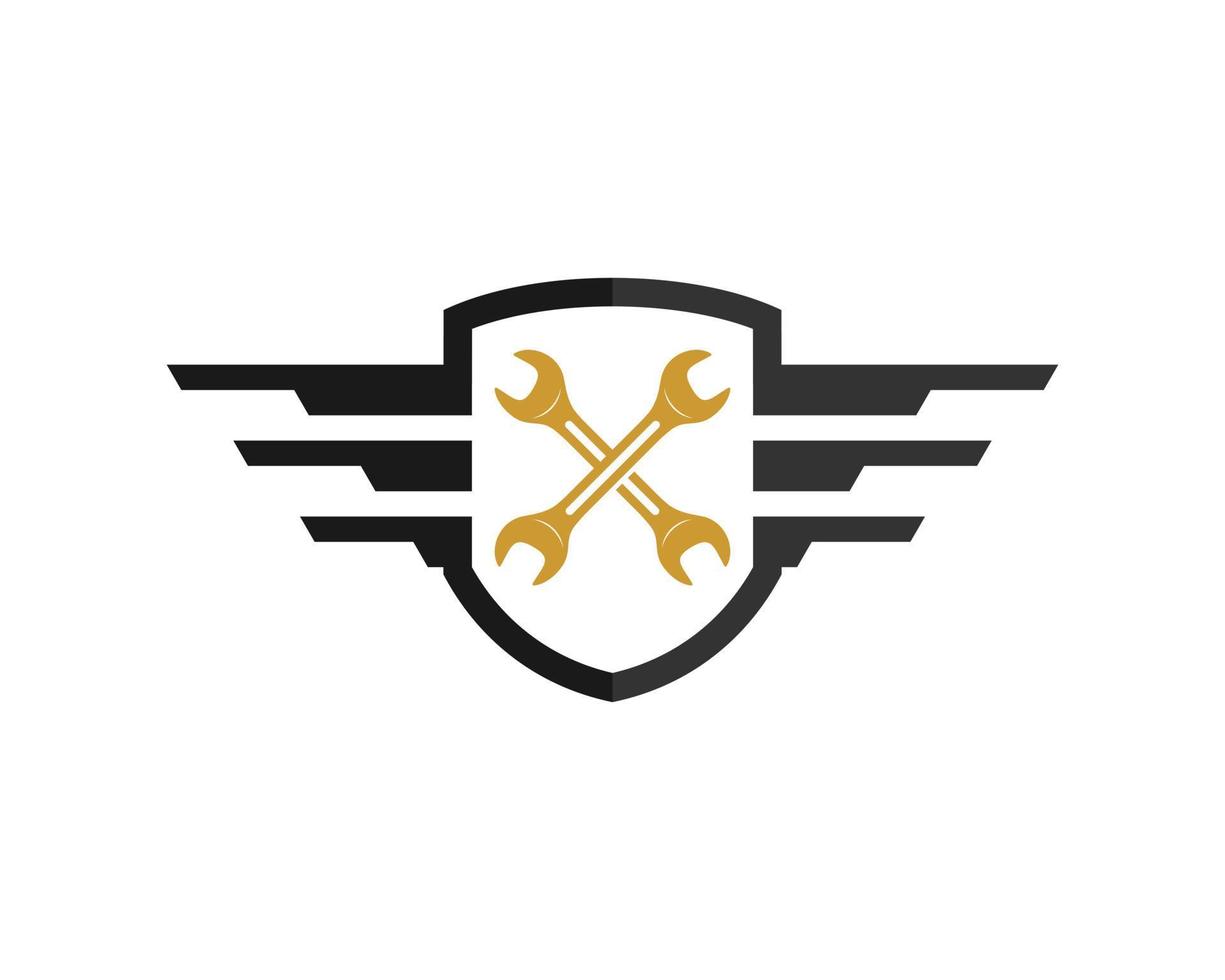 Simple shield with spread wing and cross wrench inside vector