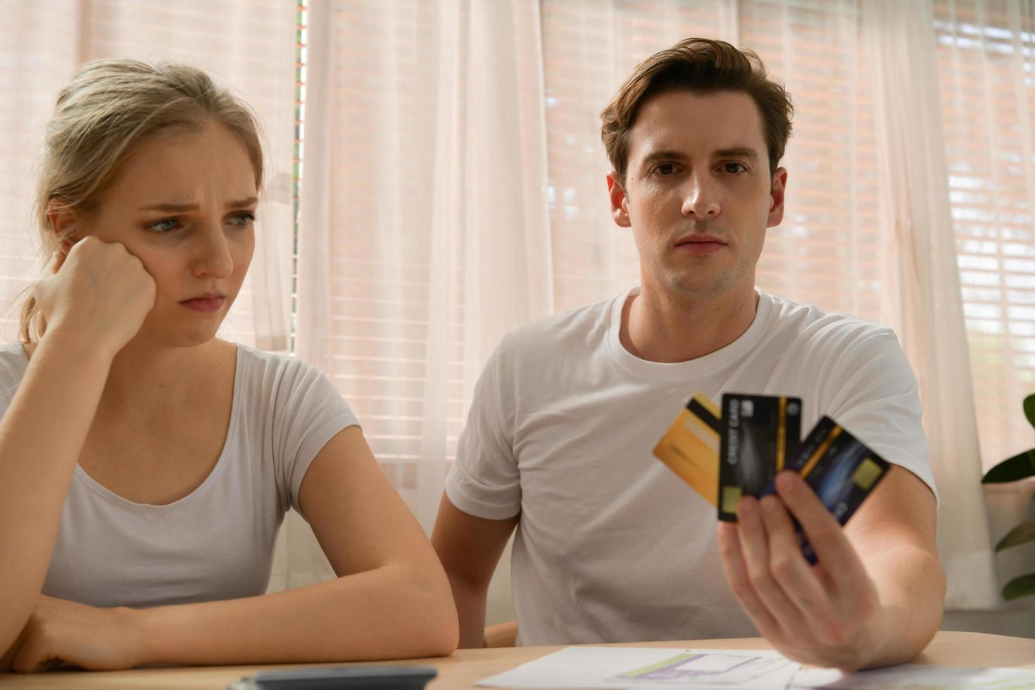 Couples with financial problems Being in a stressful mood and finding a solution for family financial problems, Need to talk about financial plans with financial advisors. photo