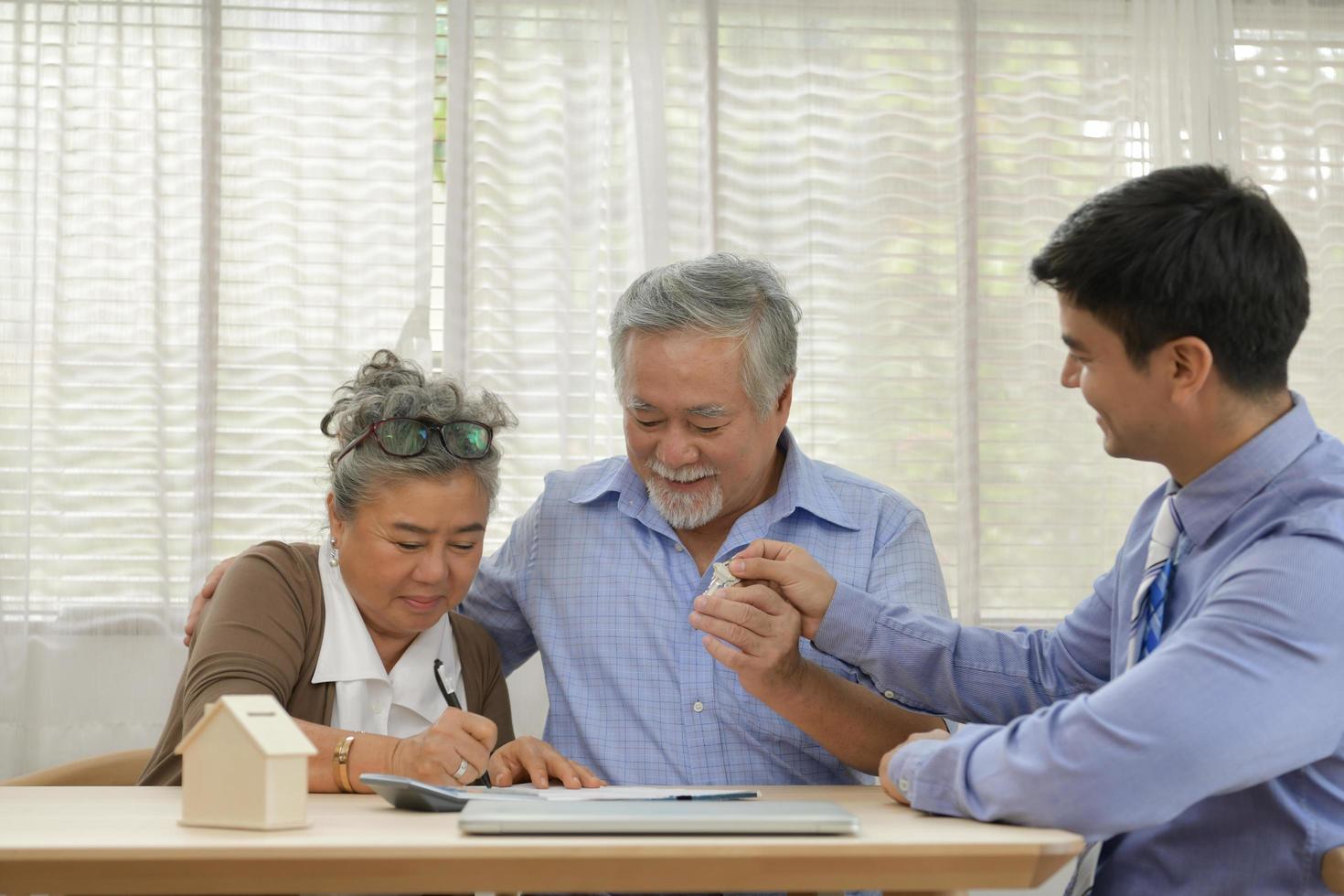 Senior couple having financial problems need discussing financial plans whit financial advisor. photo