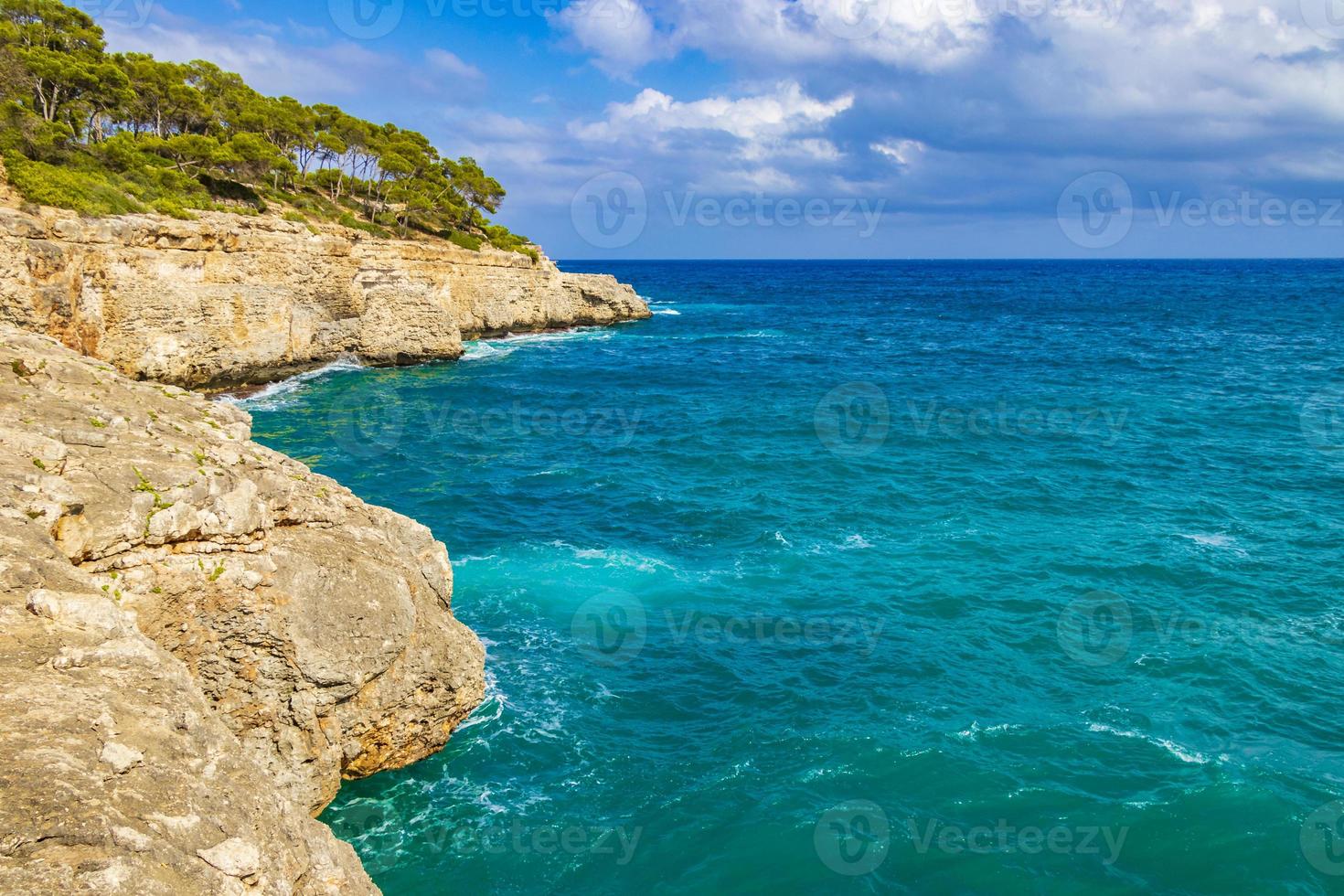 Panorama cliffs bay Cala Mondrago Mallorca Balearic Islands Spain. photo