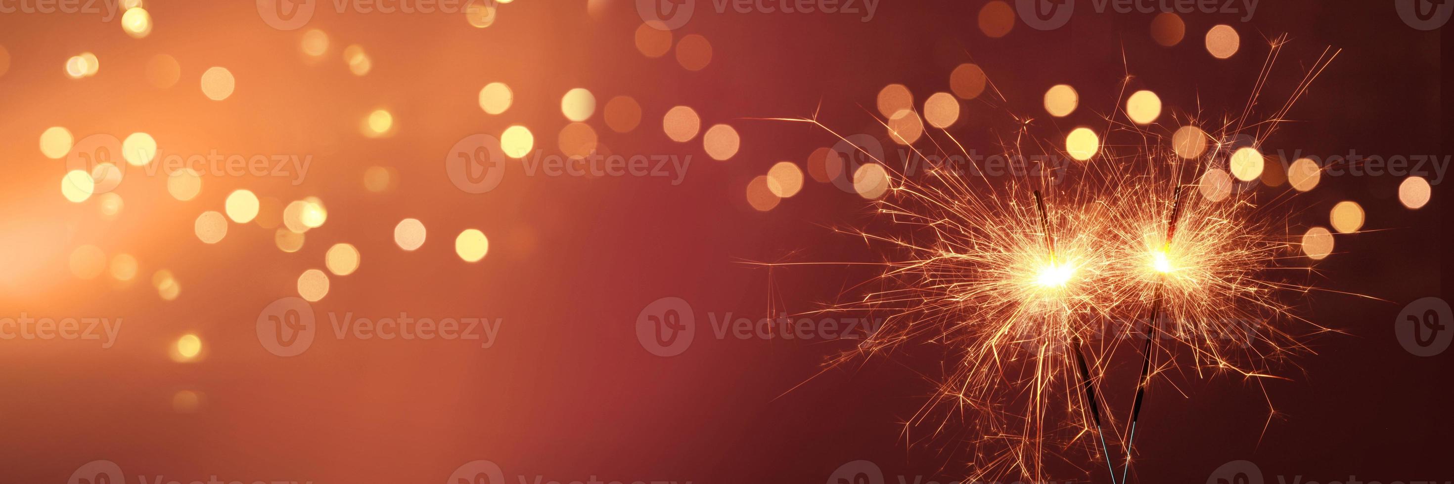 Happy New Year background with glowing sparklers. 5001234 Stock Photo