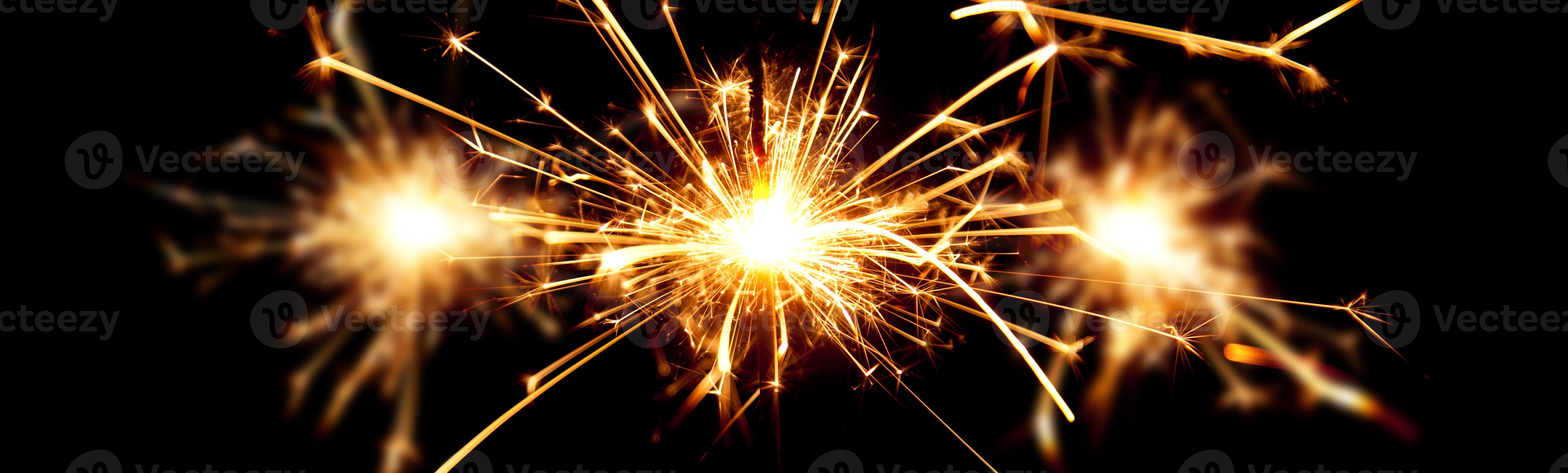 Happy New Year background with glowing sparklers. 5001257 Stock Photo