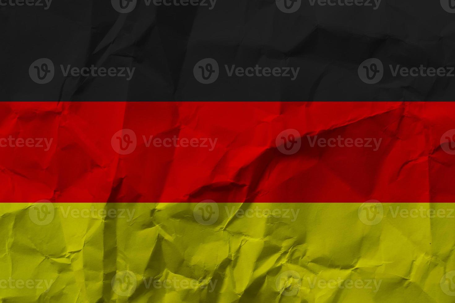 German national flag on crumpled paper. photo