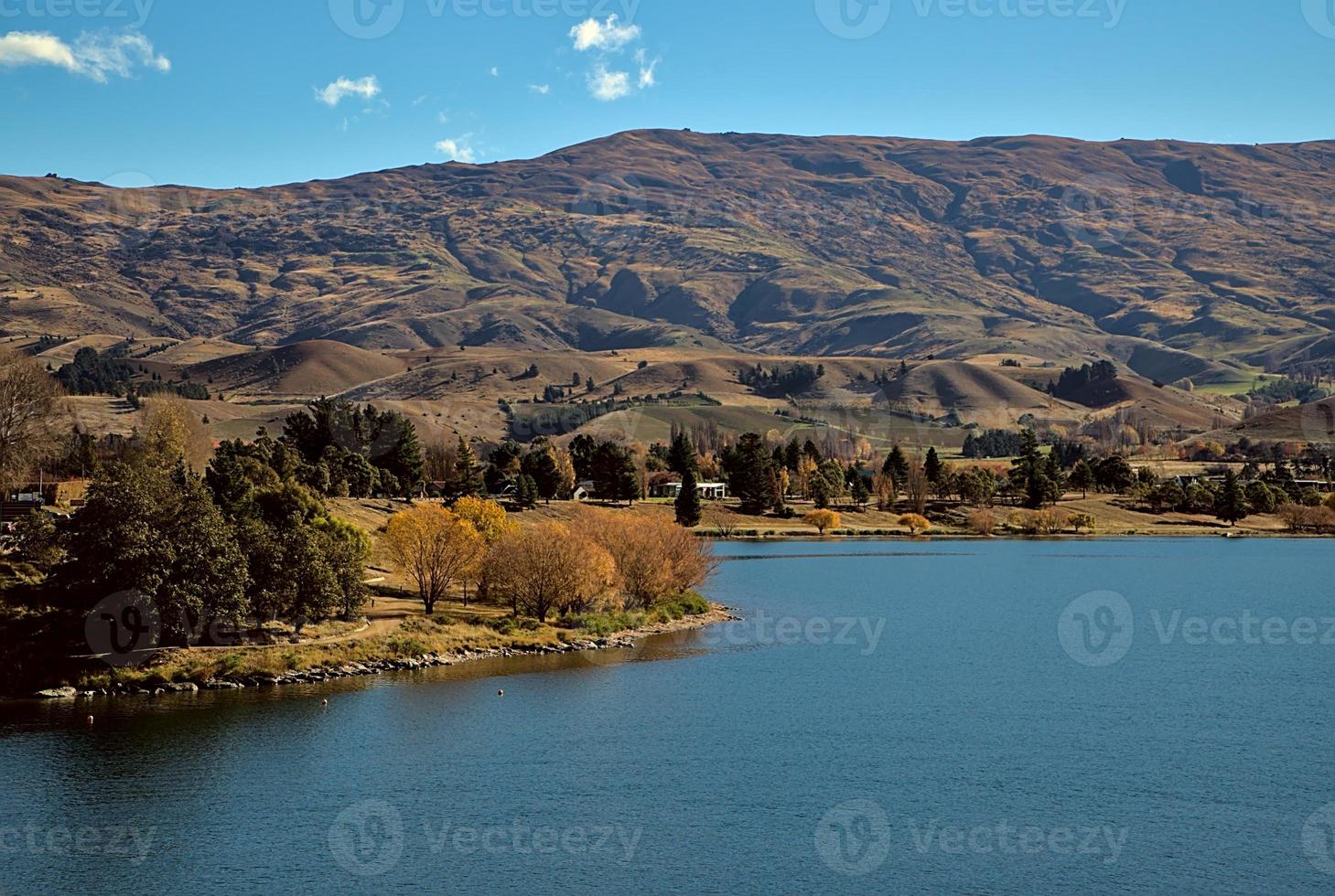 town at the lake on a sunny day of autumn photo