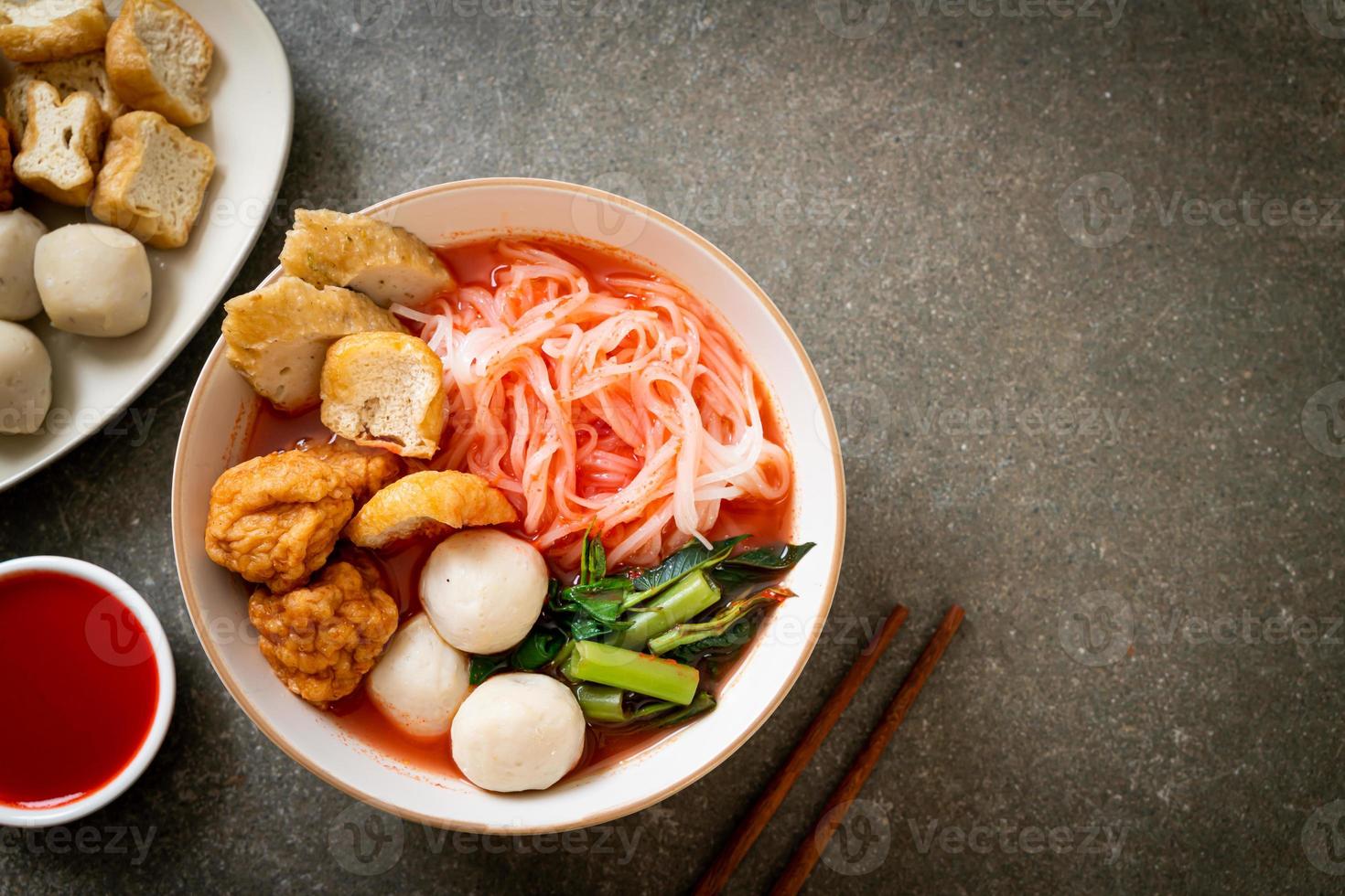 small flat rice noodles with fish balls and shrimp balls in pink soup, Yen Ta Four or Yen Ta Fo photo