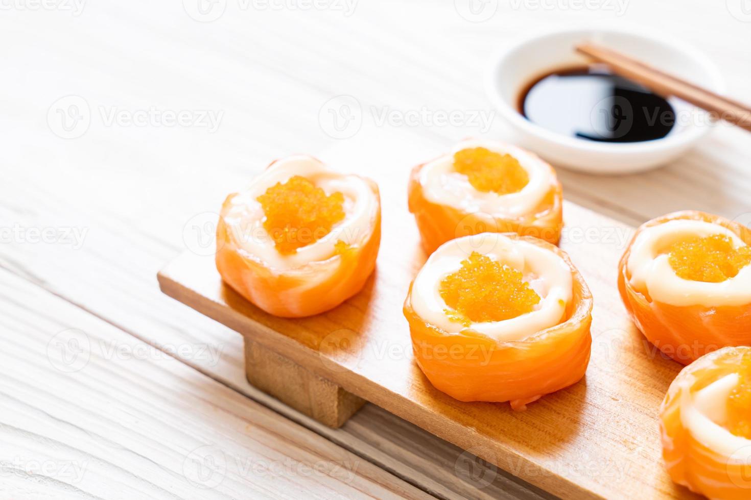 fresh salmon sushi roll with mayonnaise and shrimp egg photo