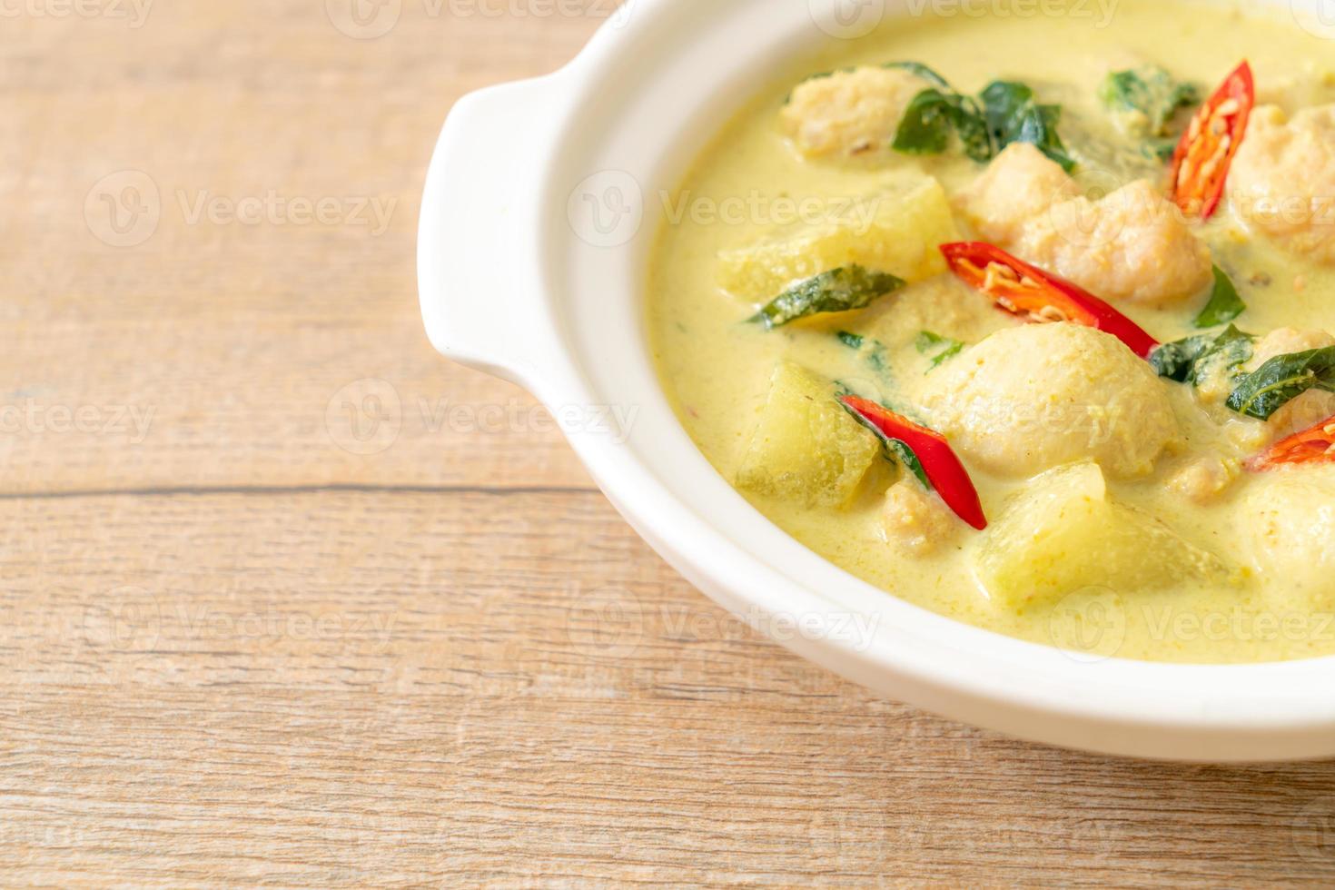 green curry soup with minced pork and meat ball photo