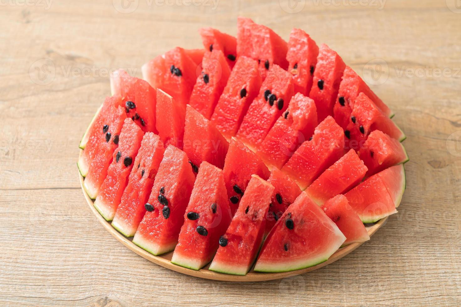 fresh watermelon sliced on plate photo