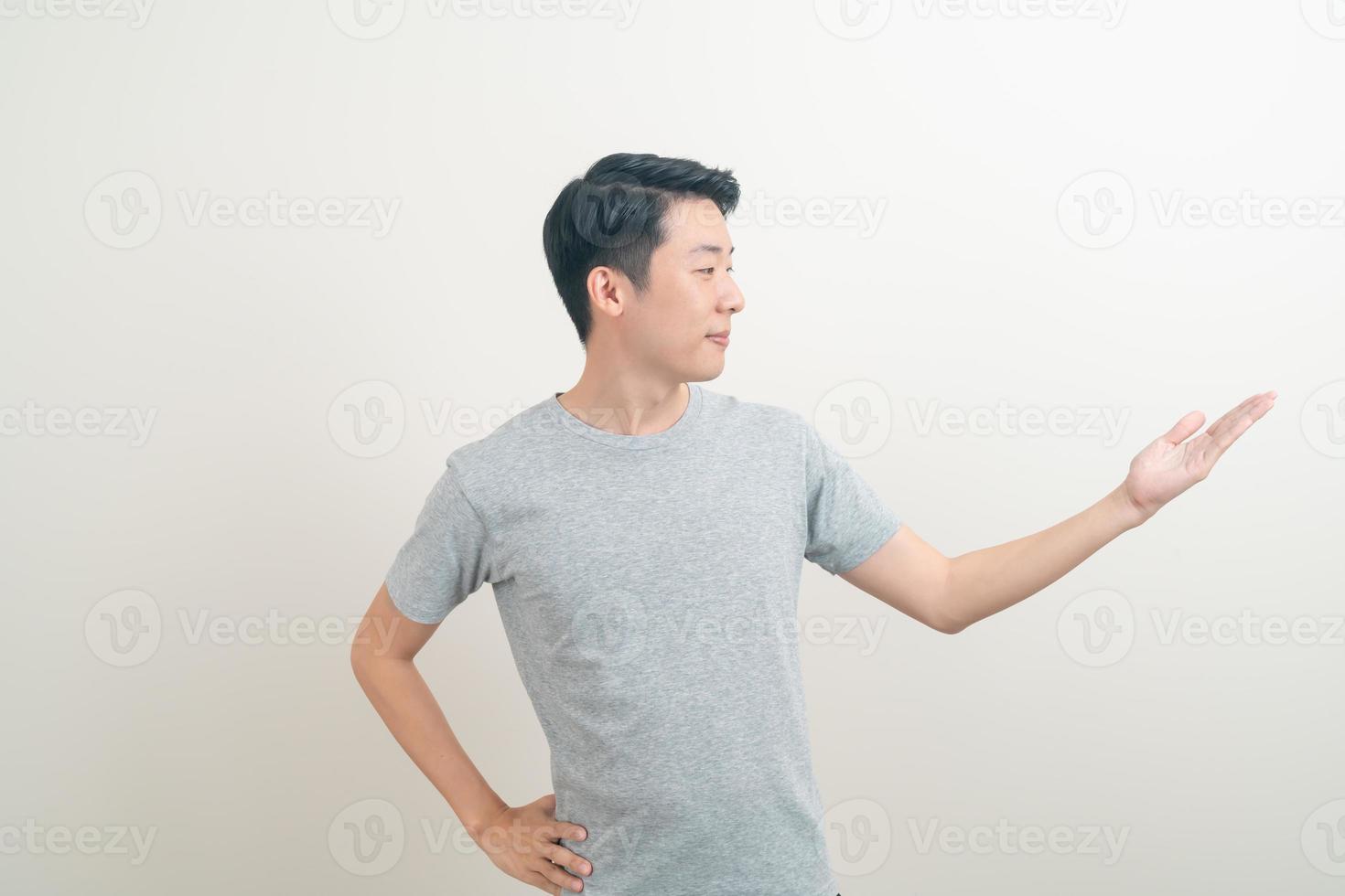 Asian man with hand pointing or presenting on white background photo