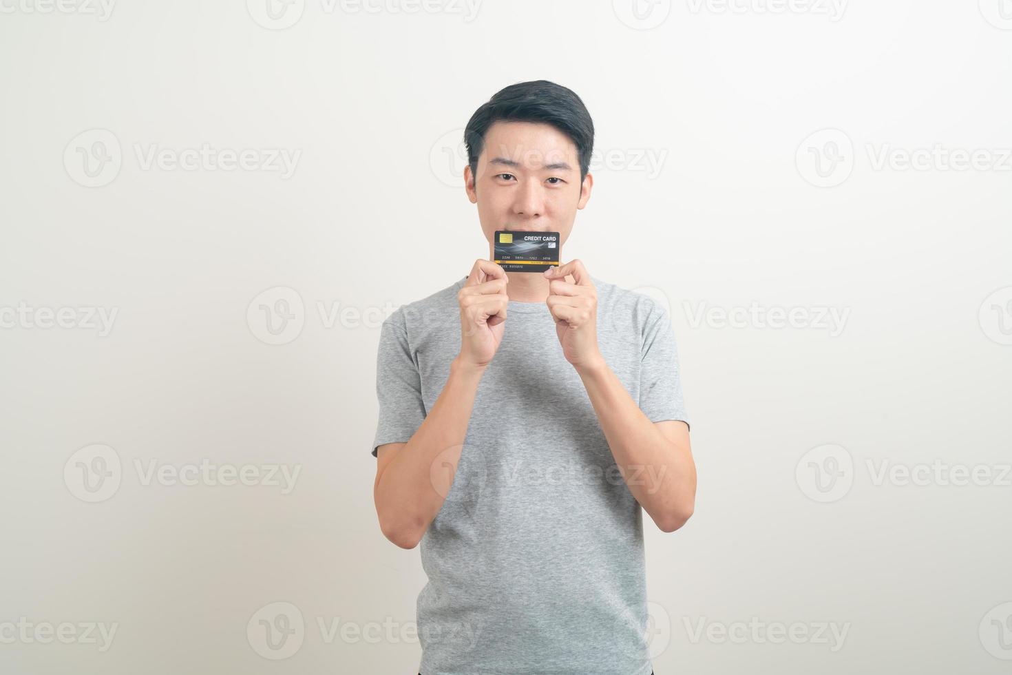 young Asian man holding credit card photo