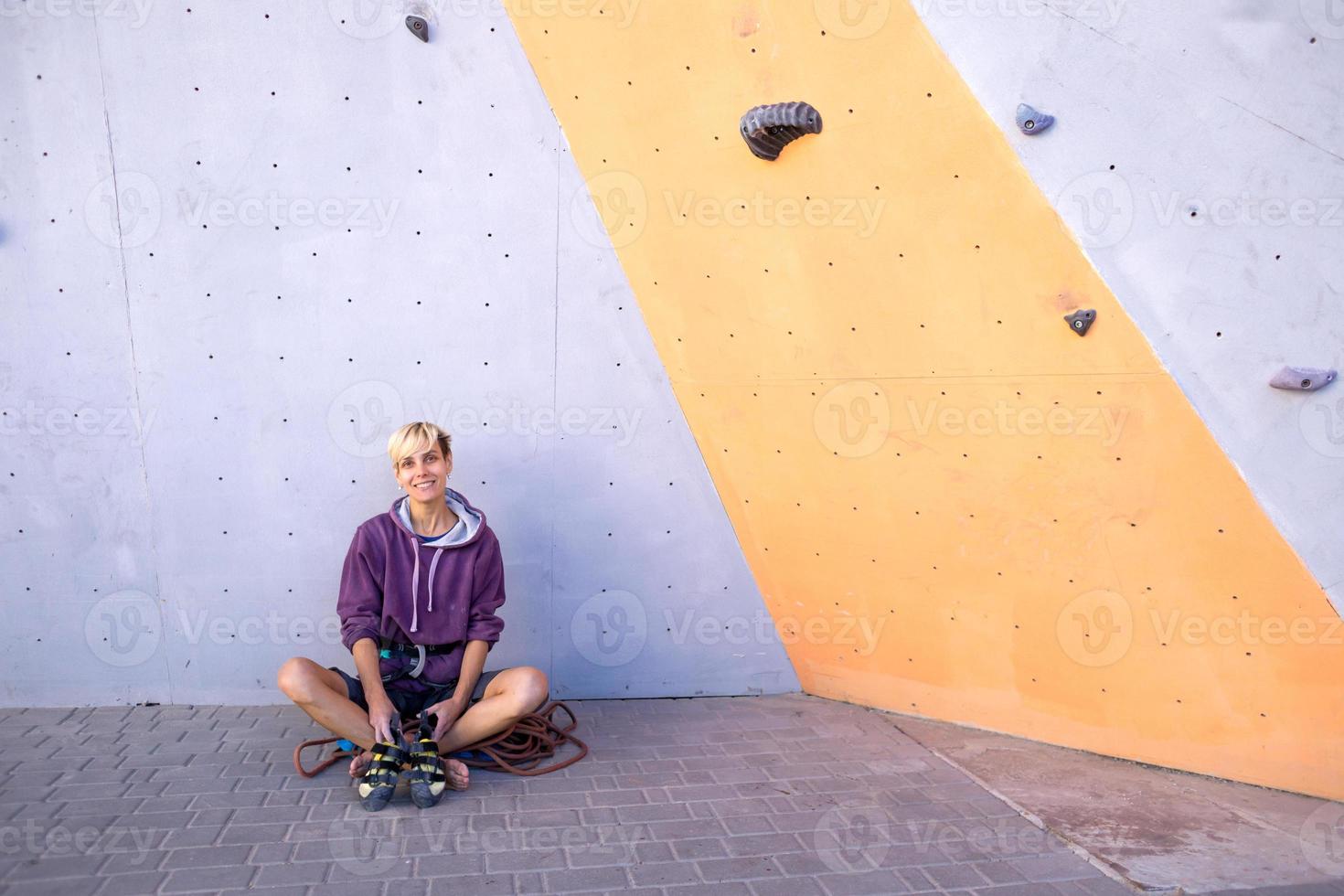 The climber is resting after climbing the route. photo