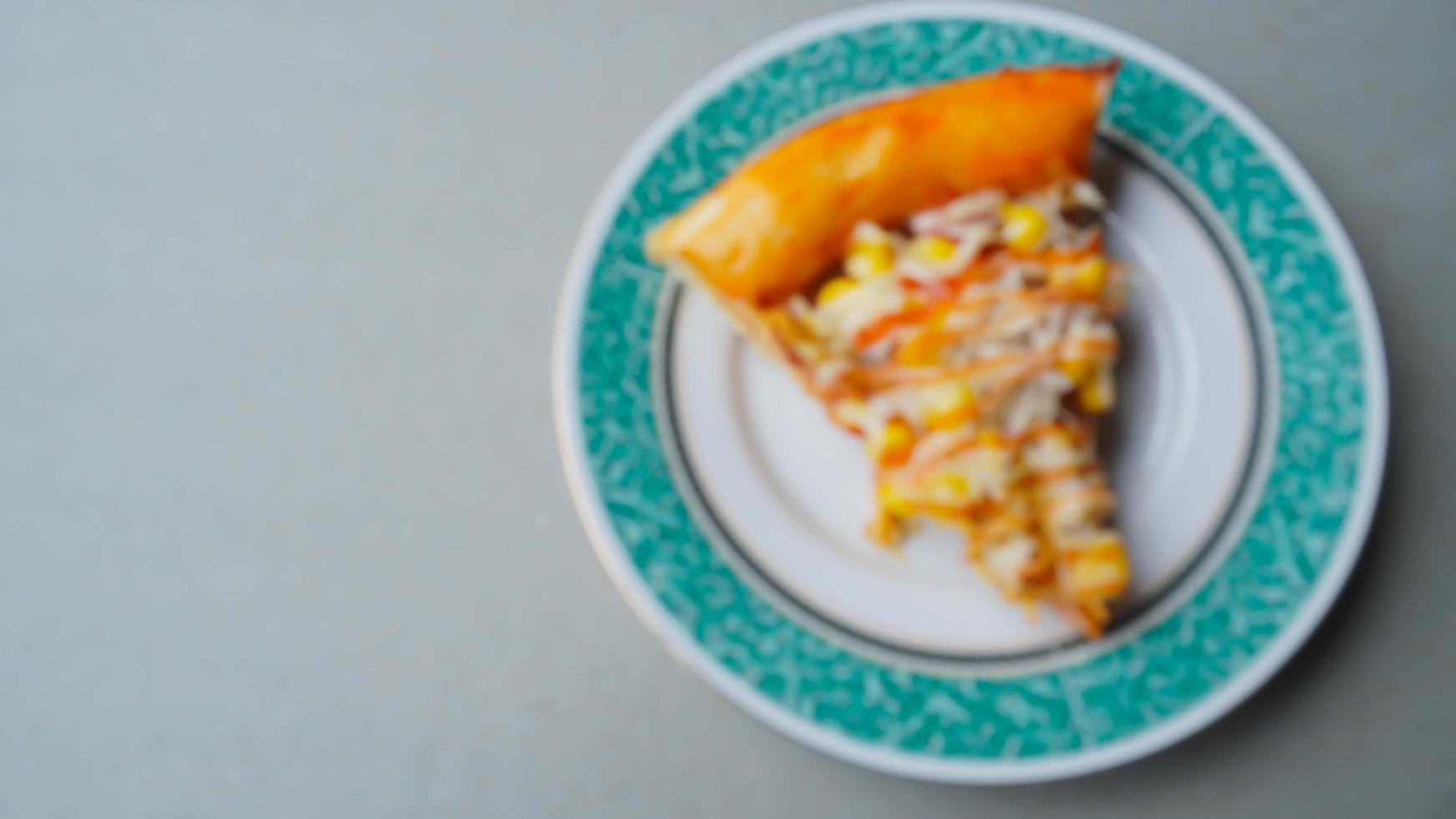 Blur photo of pizza slices on a small plate