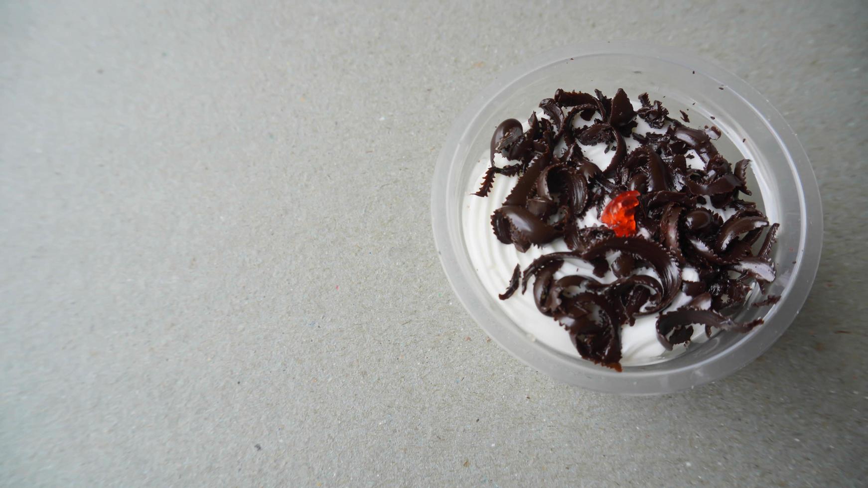 Chocolate cake in a plastic cup photo