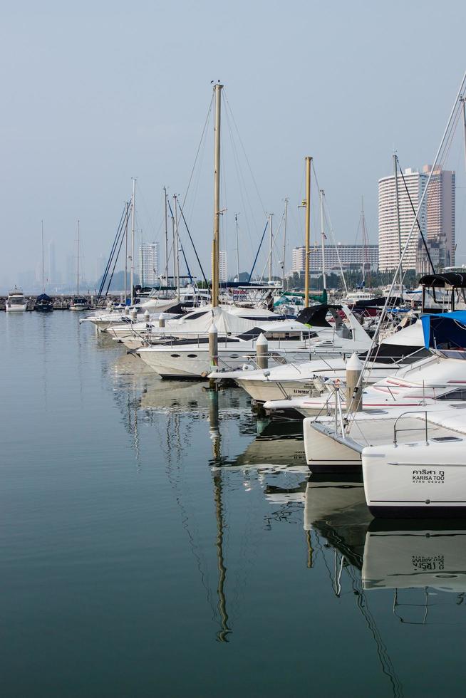 Many luxury yachts parked in a bay on the sea photo