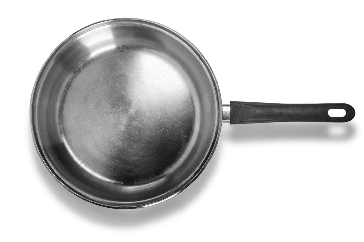 Stainless steel cooking pot isolated over white background with clipping path photo