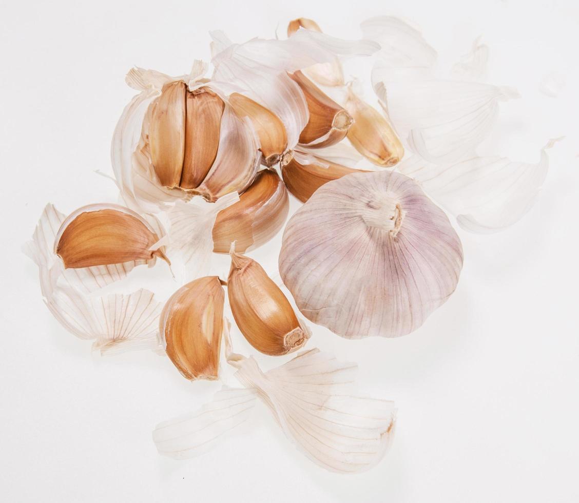 Organic garlic whole and cloves on the white background photo