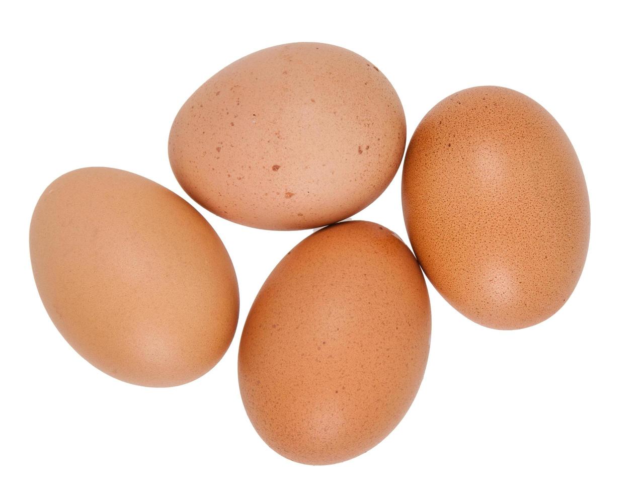 Close-up view of raw chicken eggs in egg box photo