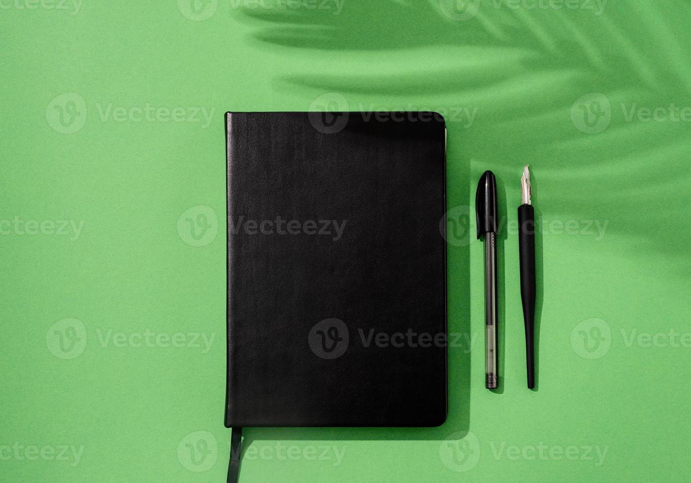 Minimal style blank calendar for mock up, notebook, trendy glasses, watch and pencil on white backdrop photo