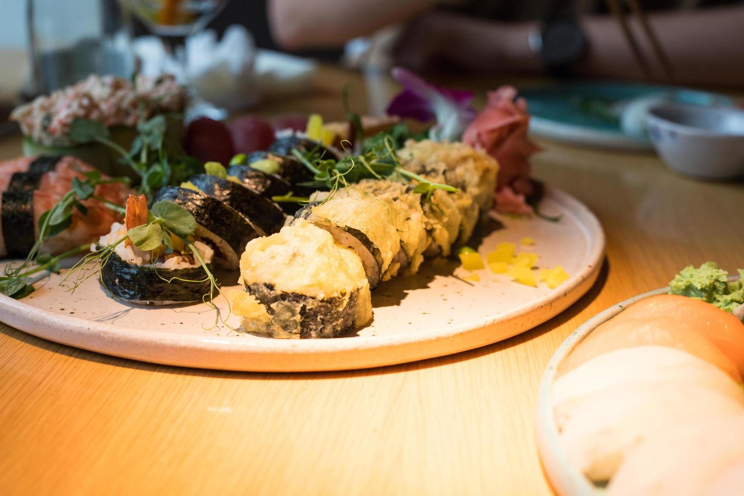 A plate of sushi. Different types of Japanese food. Delicious food in the restaurant during the meeting. photo