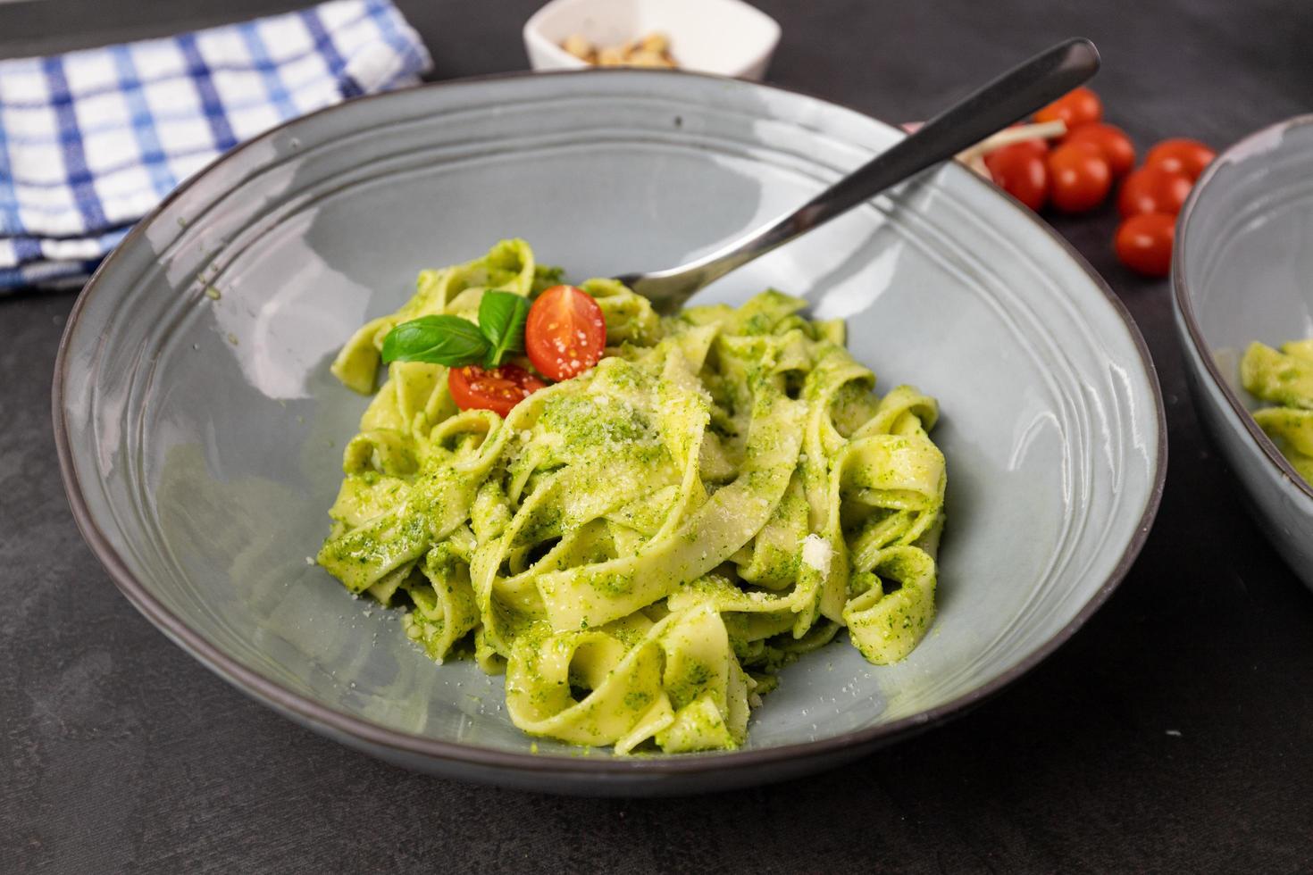 Pasta with basil pesto top view. photo