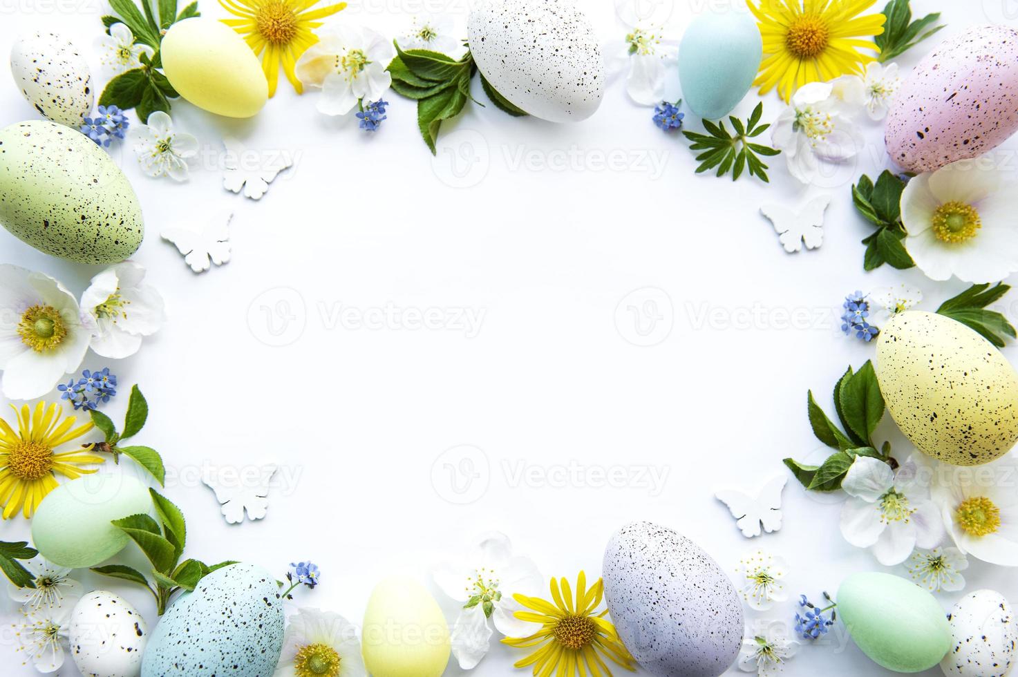 Colorful Easter eggs with spring blossom flowers photo