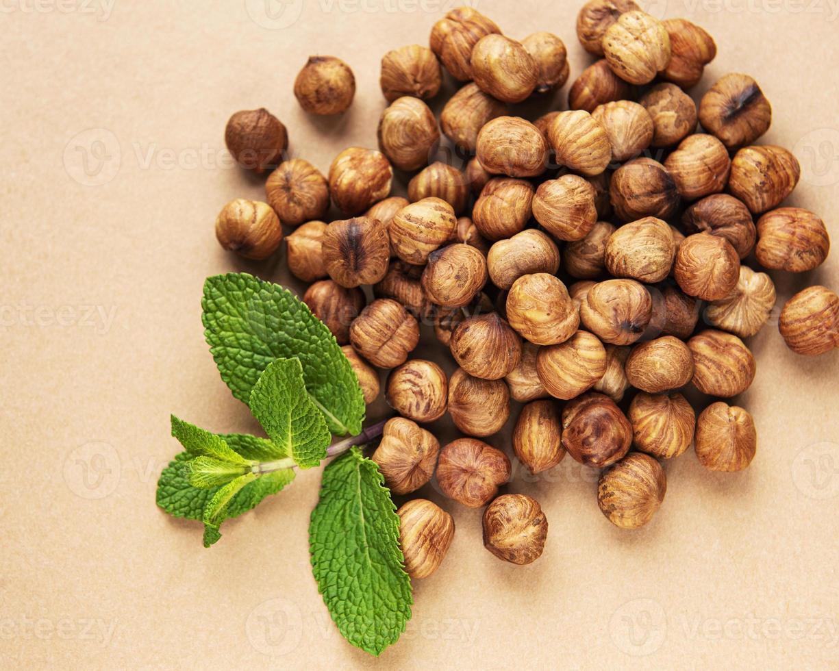 Peeled hazelnuts on a table photo