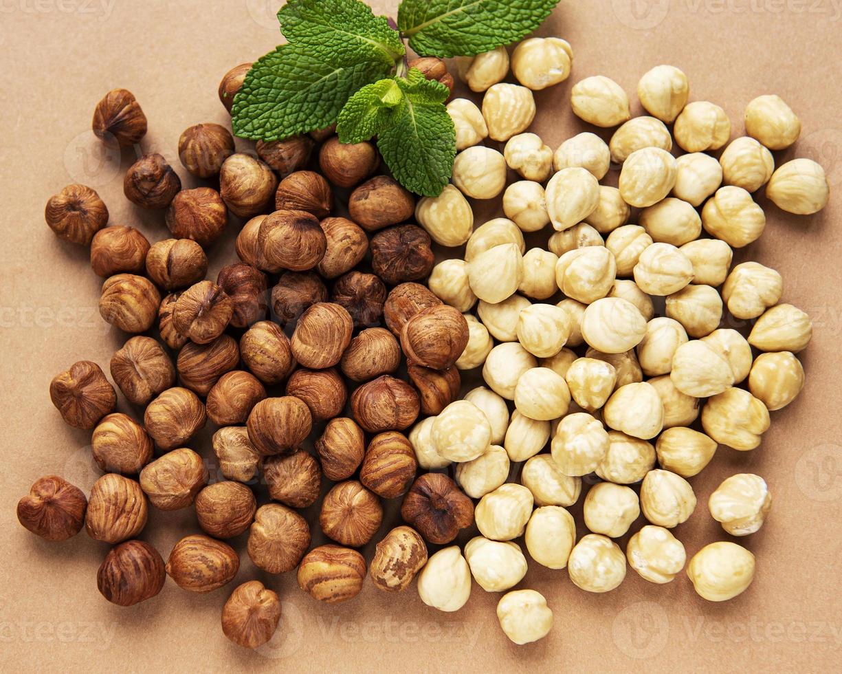 Peeled hazelnuts on a table photo