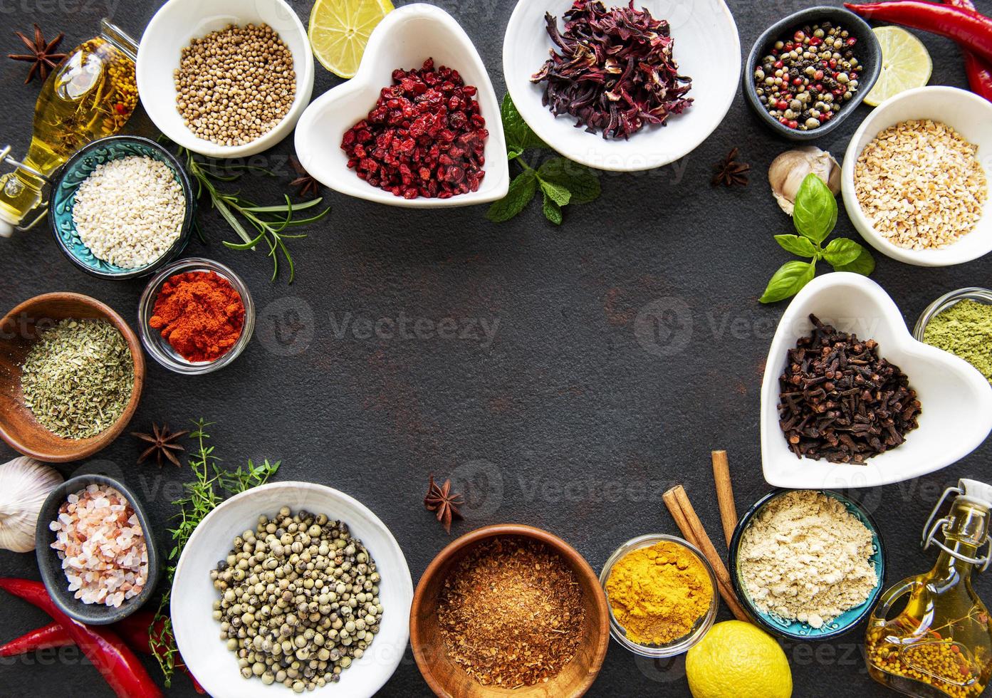 Various spices in a bowls on a black photo