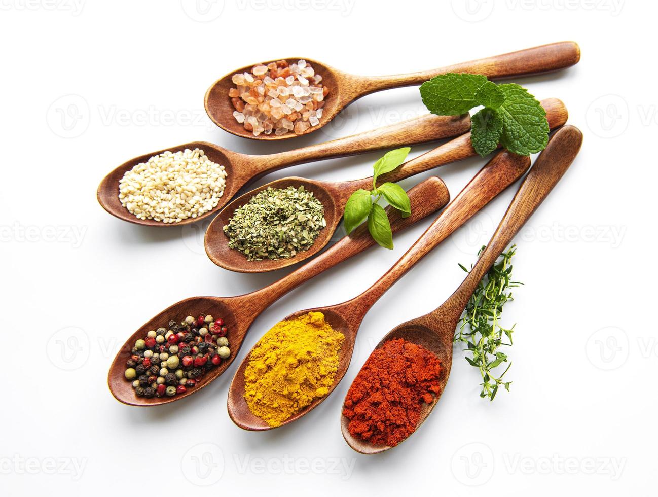 Various spices isolated on white background, top view photo