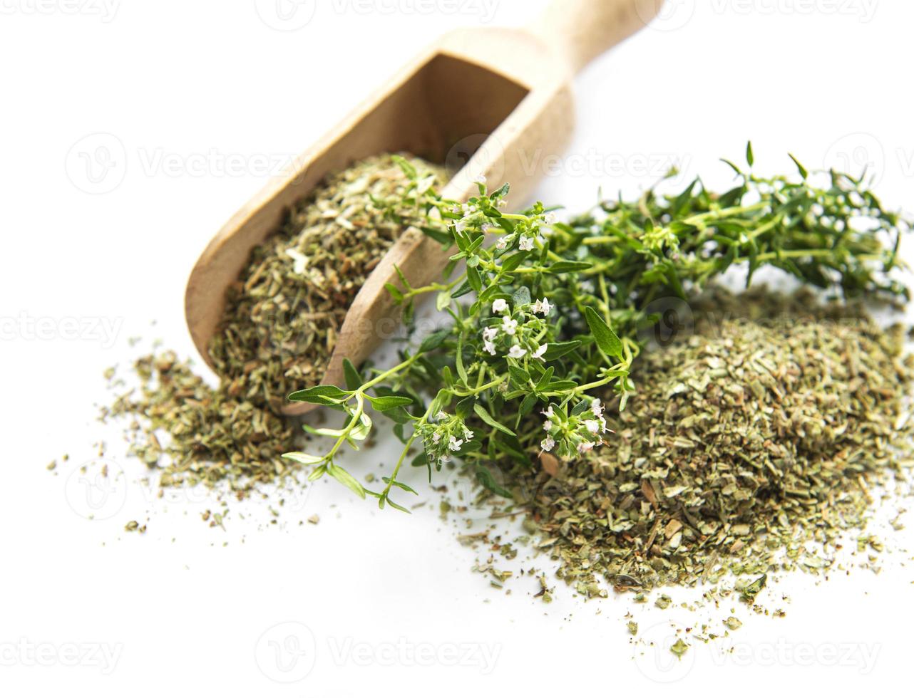 Fresh and dry thyme on white background photo