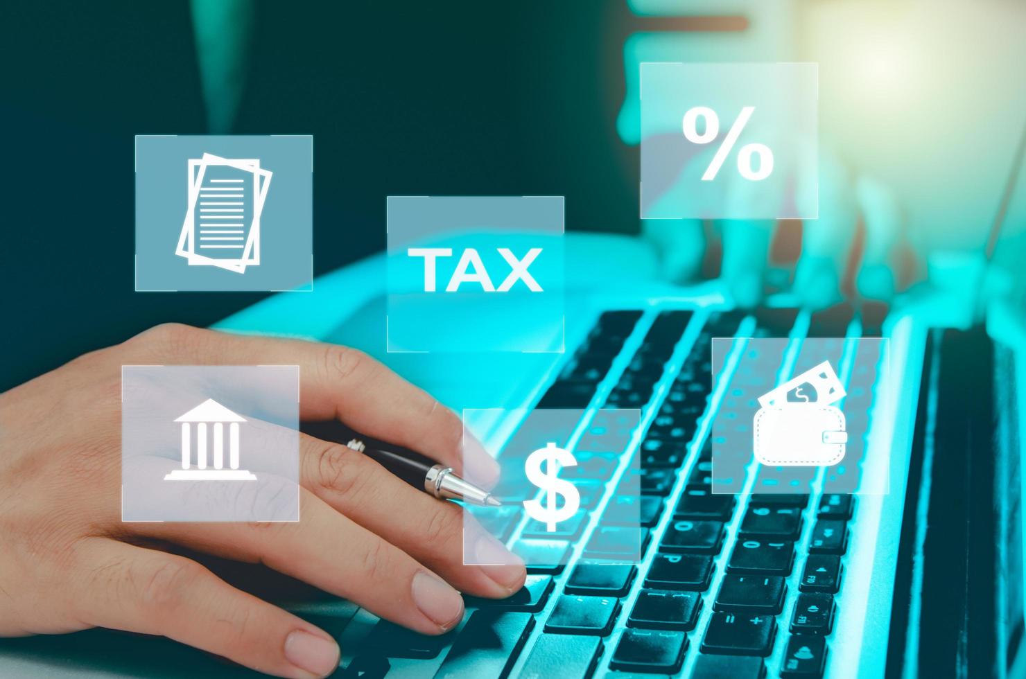 Man hand computer laptop virtual icon business tax. Business finance, investment and online tax payment. Technology concept on the Internet. photo