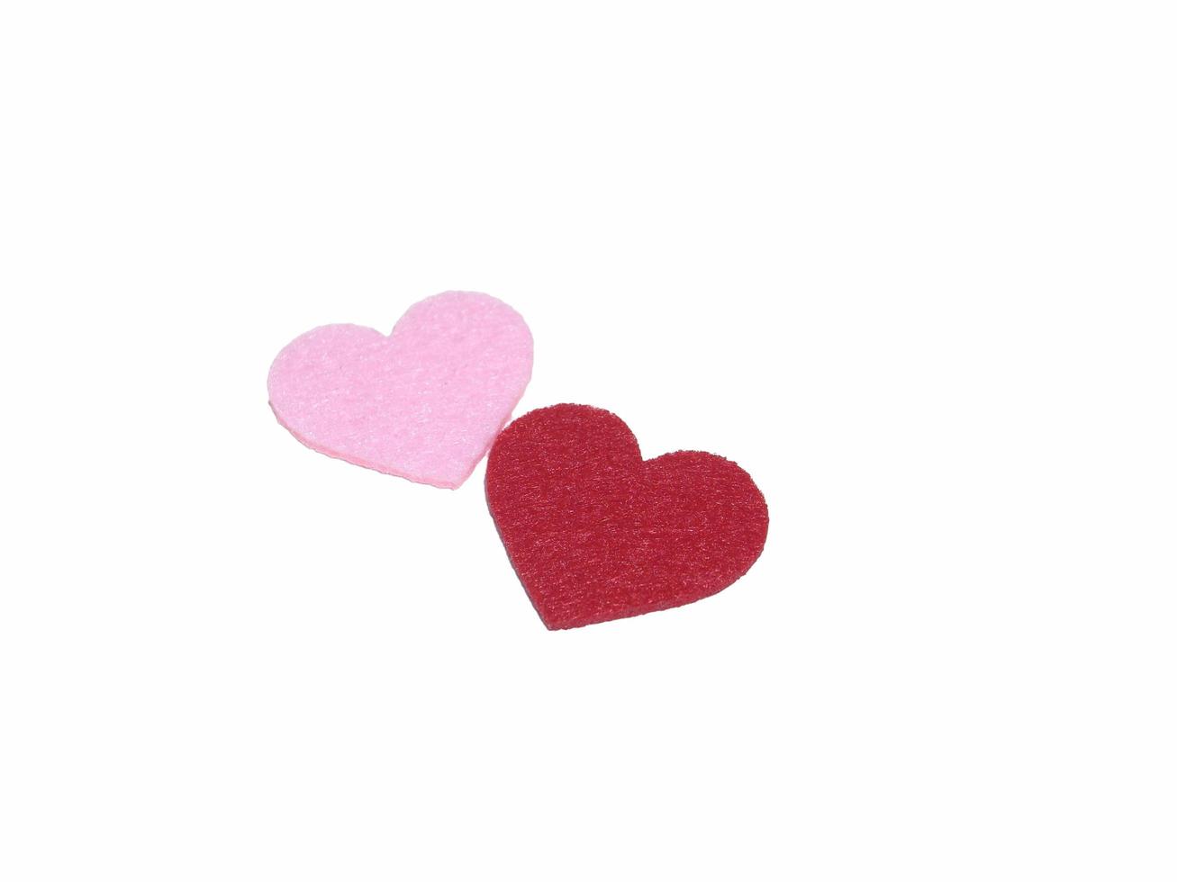 Multicolored heart shapes on a light background photo