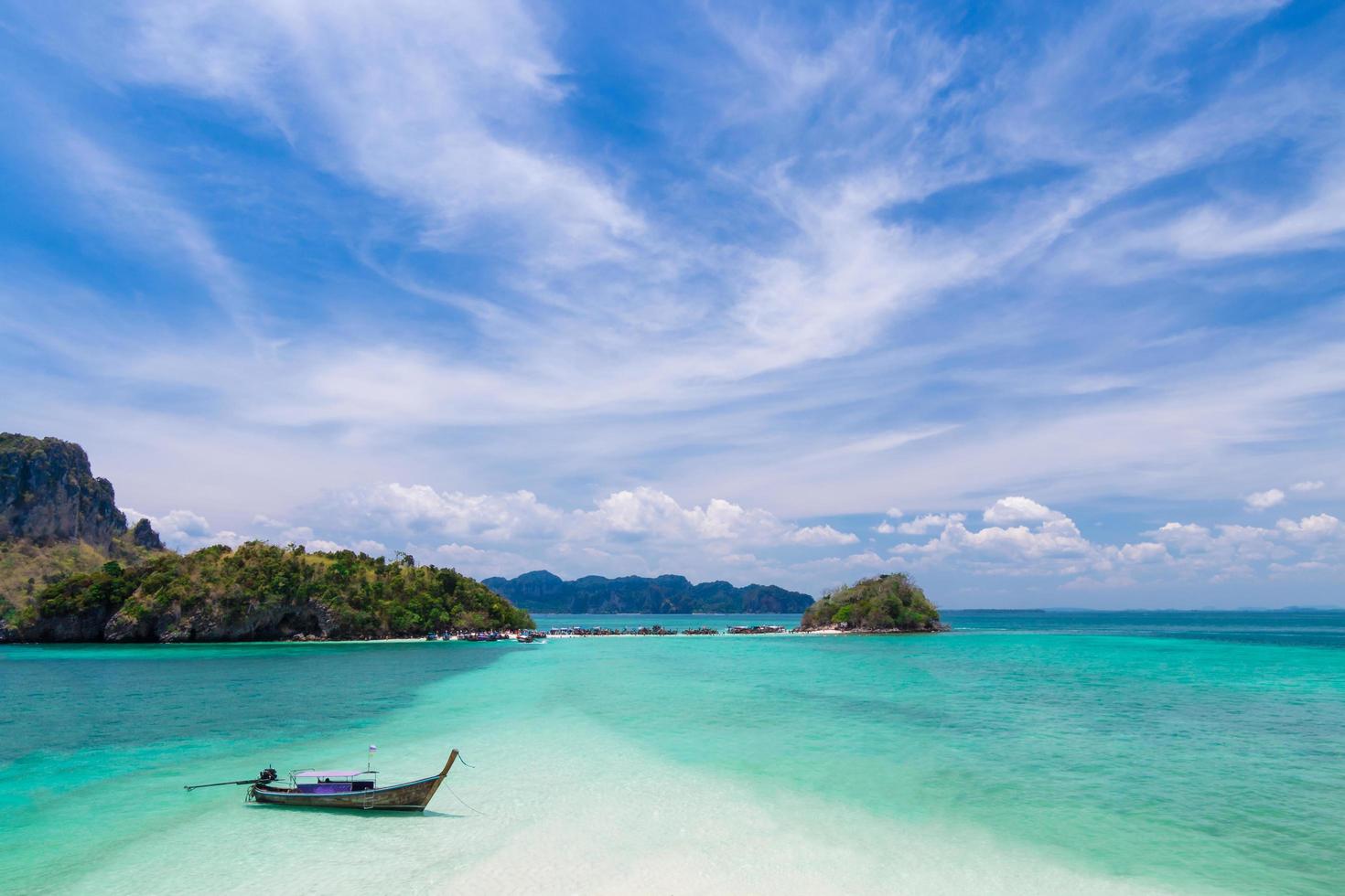 Thai long tail boats on the beach with beautiful island, Krabi Phuket Thailand photo