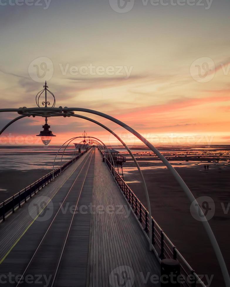 Southport pier panoramic view at sunset with scenic landscape and no people. Romantic travel destination United Kingdom photo
