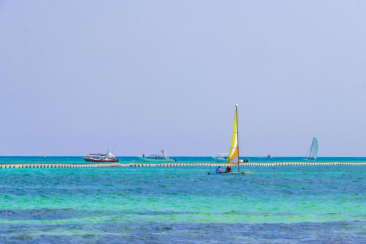 Boats yachts between Cozumel island and Playa del Carmen Mexico. photo