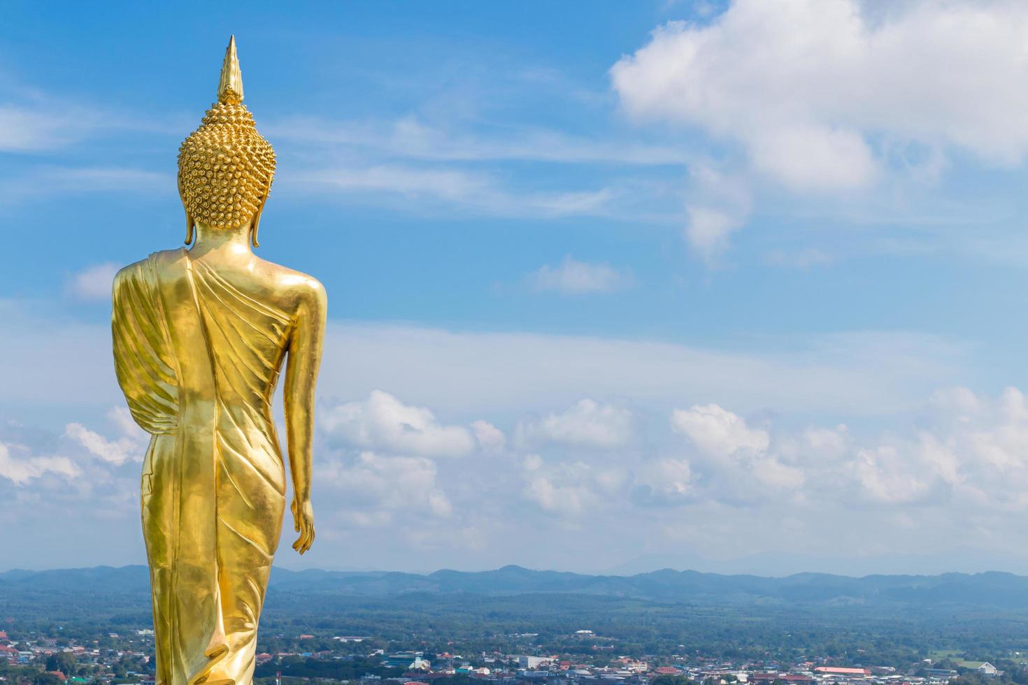 The back of golden Buddha at Khao Noi temple, Nan Thailand photo