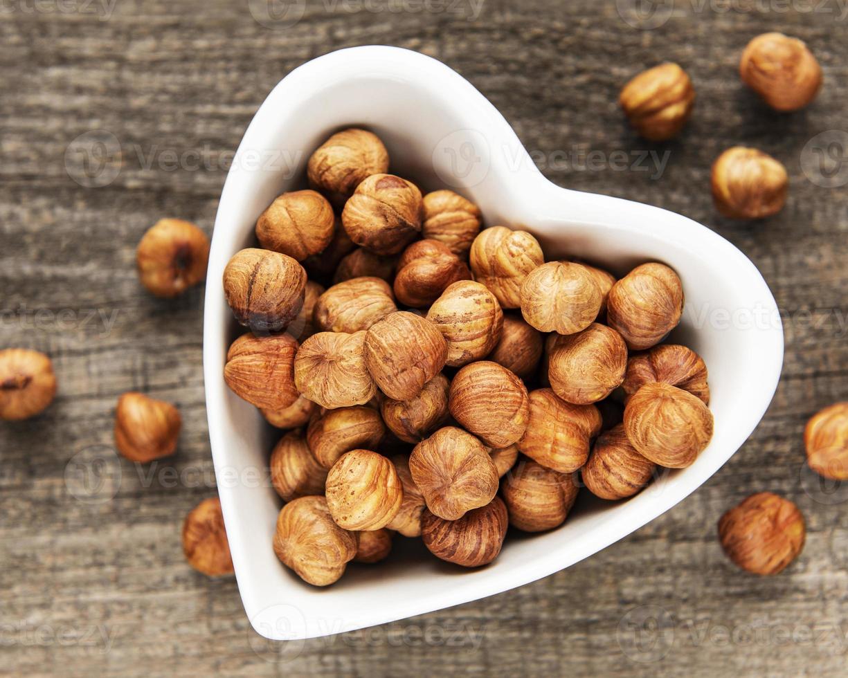 Peeled hazelnuts on a table photo