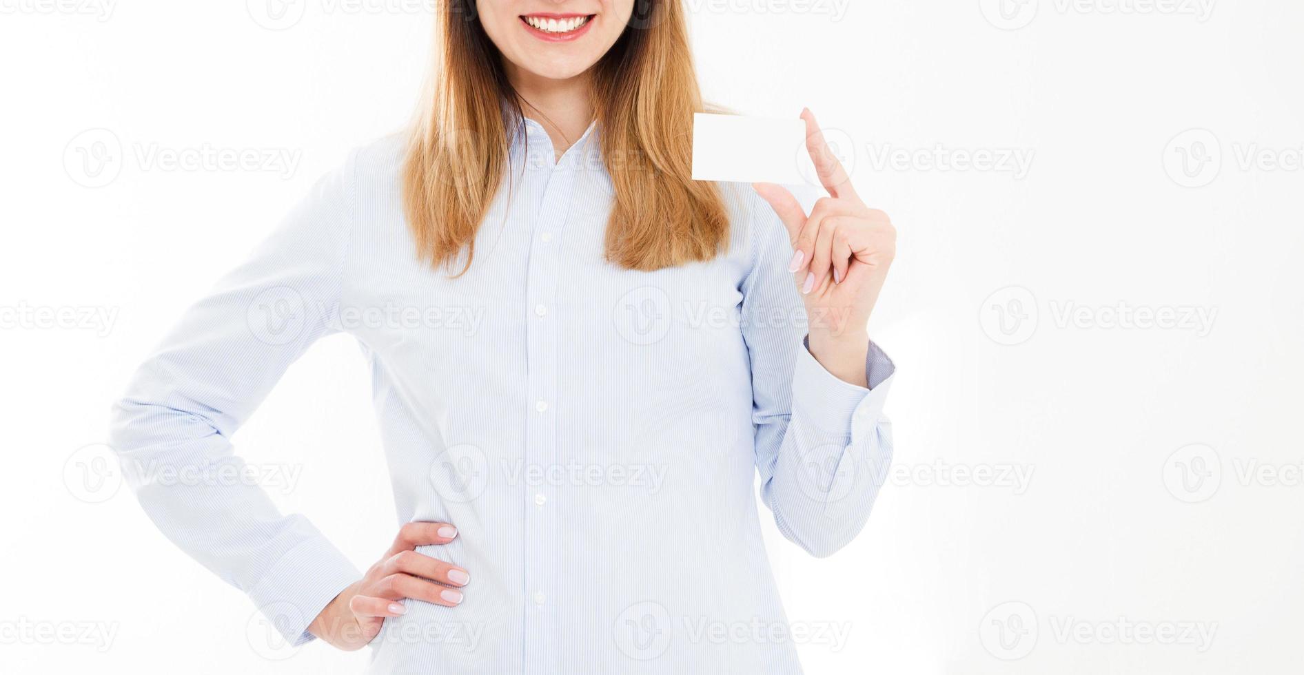 Young smiling woman holding a blank business card isolated on white background. Copy space photo