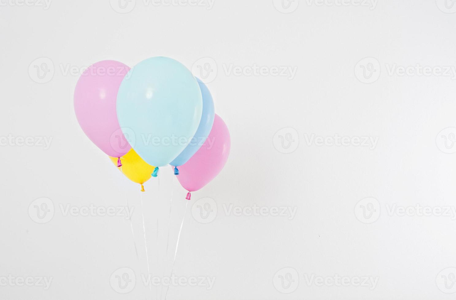 Colorful party balloons background. Isolated on white. Copy space photo