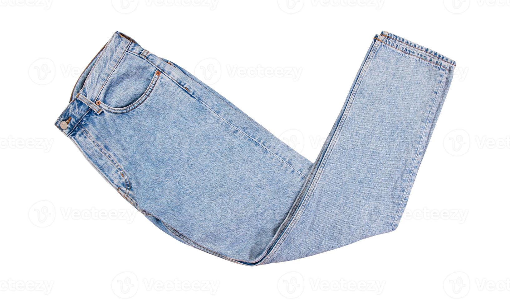 Pantalones de mezclilla aislados, jeans doblados azul aislado sobre fondo blanco de cerca foto